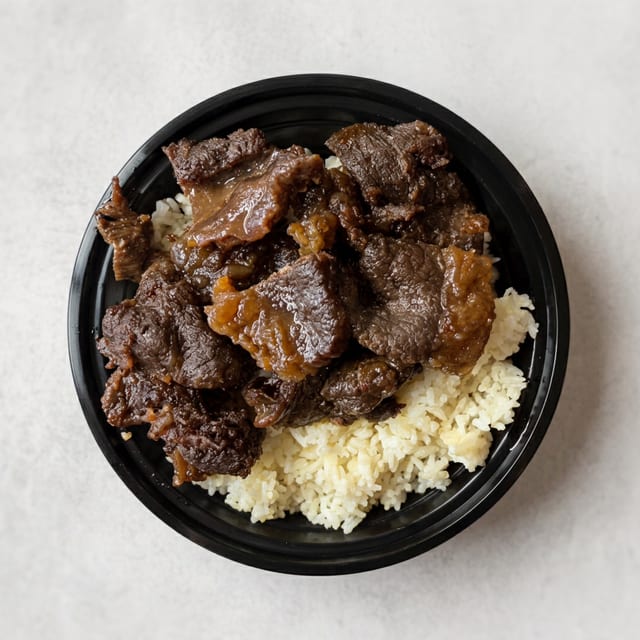 Tapsilog (Beef Tapa) Served with Garlic Rice and 2 Eggs.